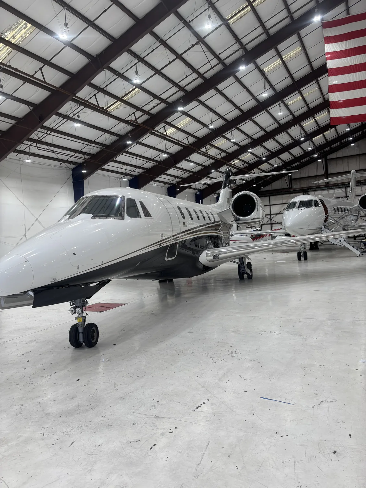 Private jet parked in a detailing hangar